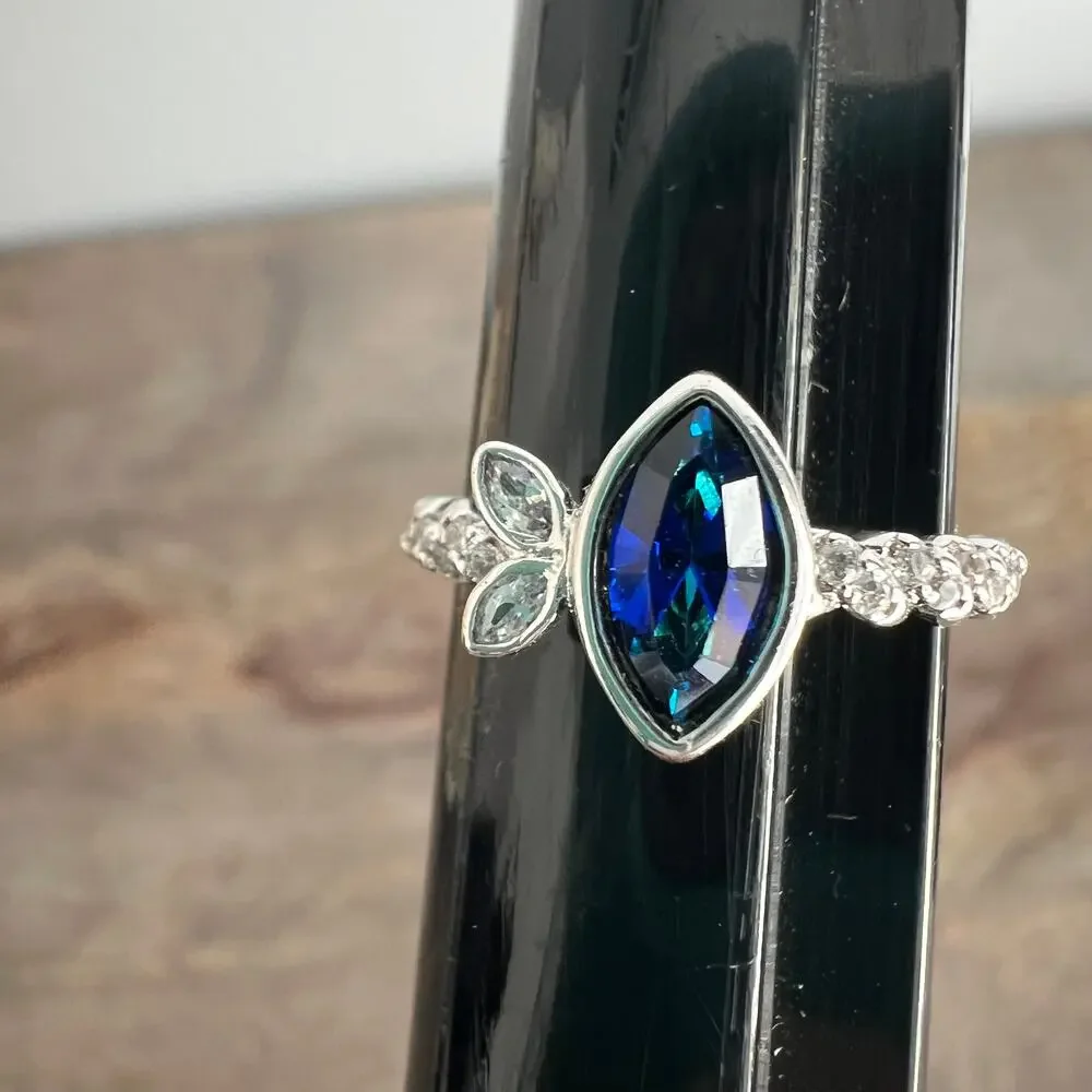 Sapphire blue colored crystal studded elegant ring on silver tone band size 6.25
